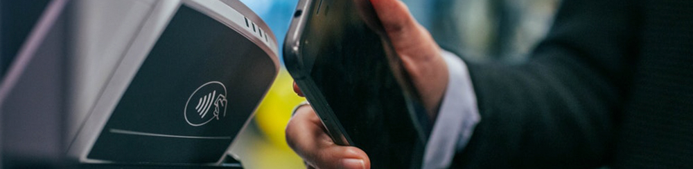 Man using NFC technology for payment